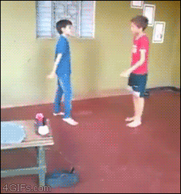 kid kicks pal GIF